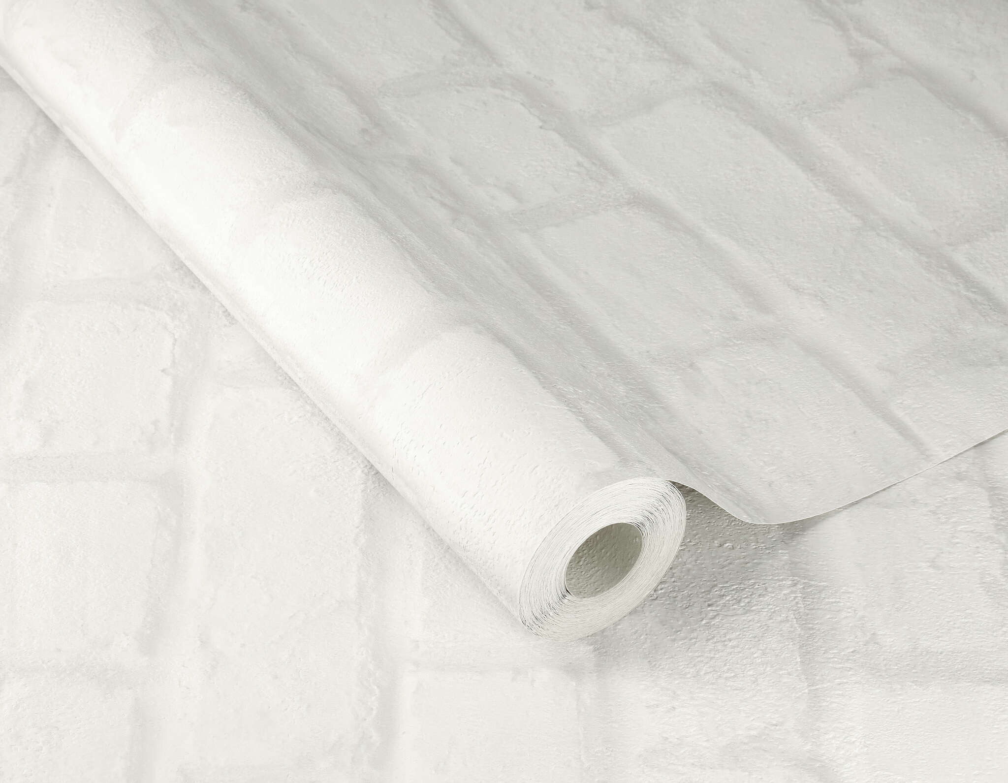 10-201710 Detailaufnahmen 1 Detailed image of Wallpaper with a three-dimensional brick pattern in white for a bright loft look
