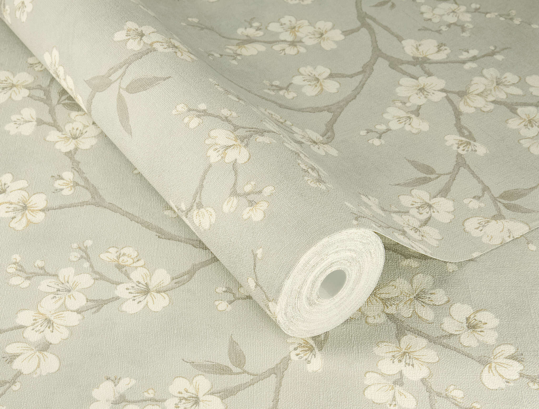 10-456752 Detailaufnahmen 1 Detailed image of Natural non-woven wallpaper with floral branches on a subtle grey background