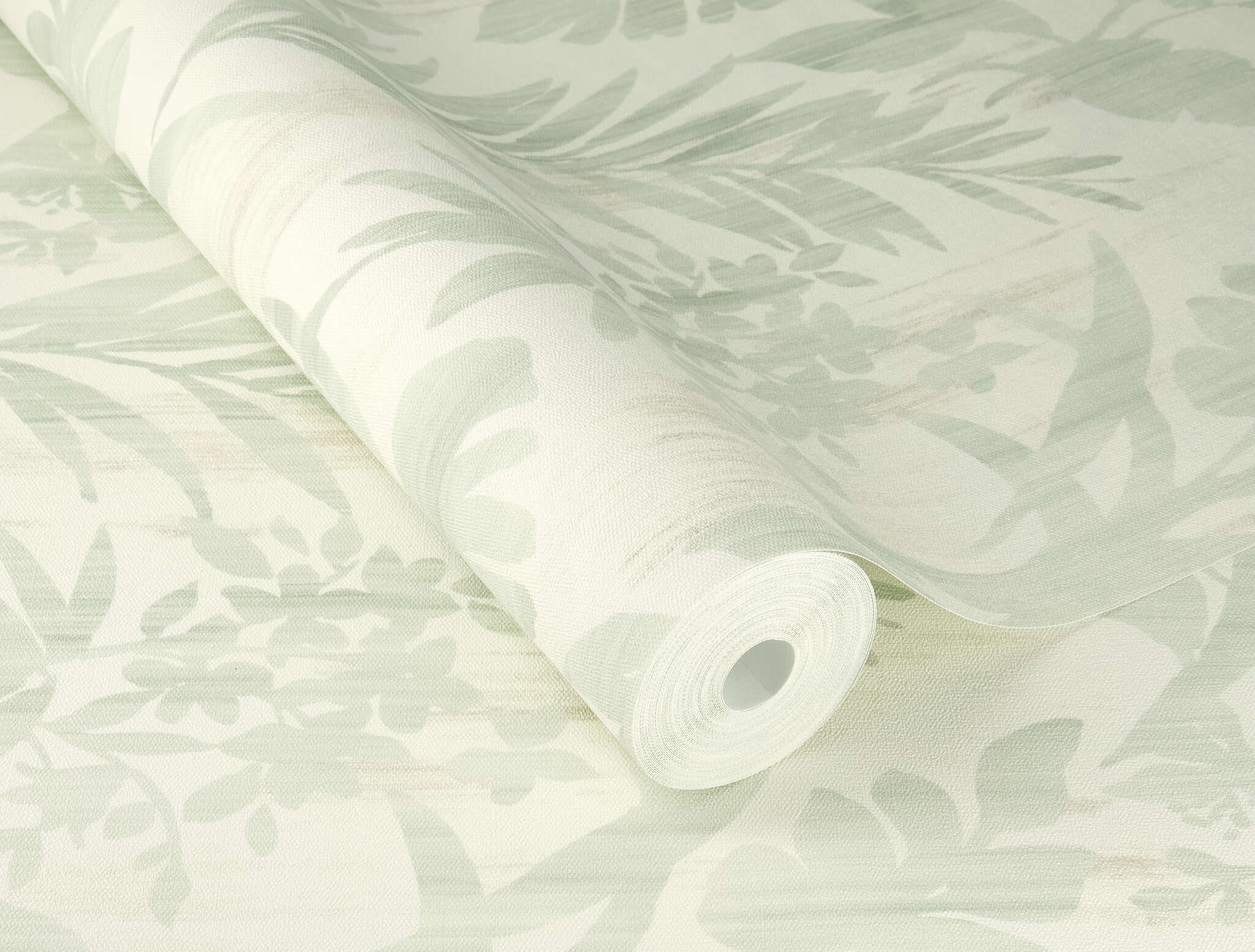10-410587 Detailaufnahmen 1 Detailed image of Non-woven wallpaper with tropical leaf pattern in mint green on a light background.