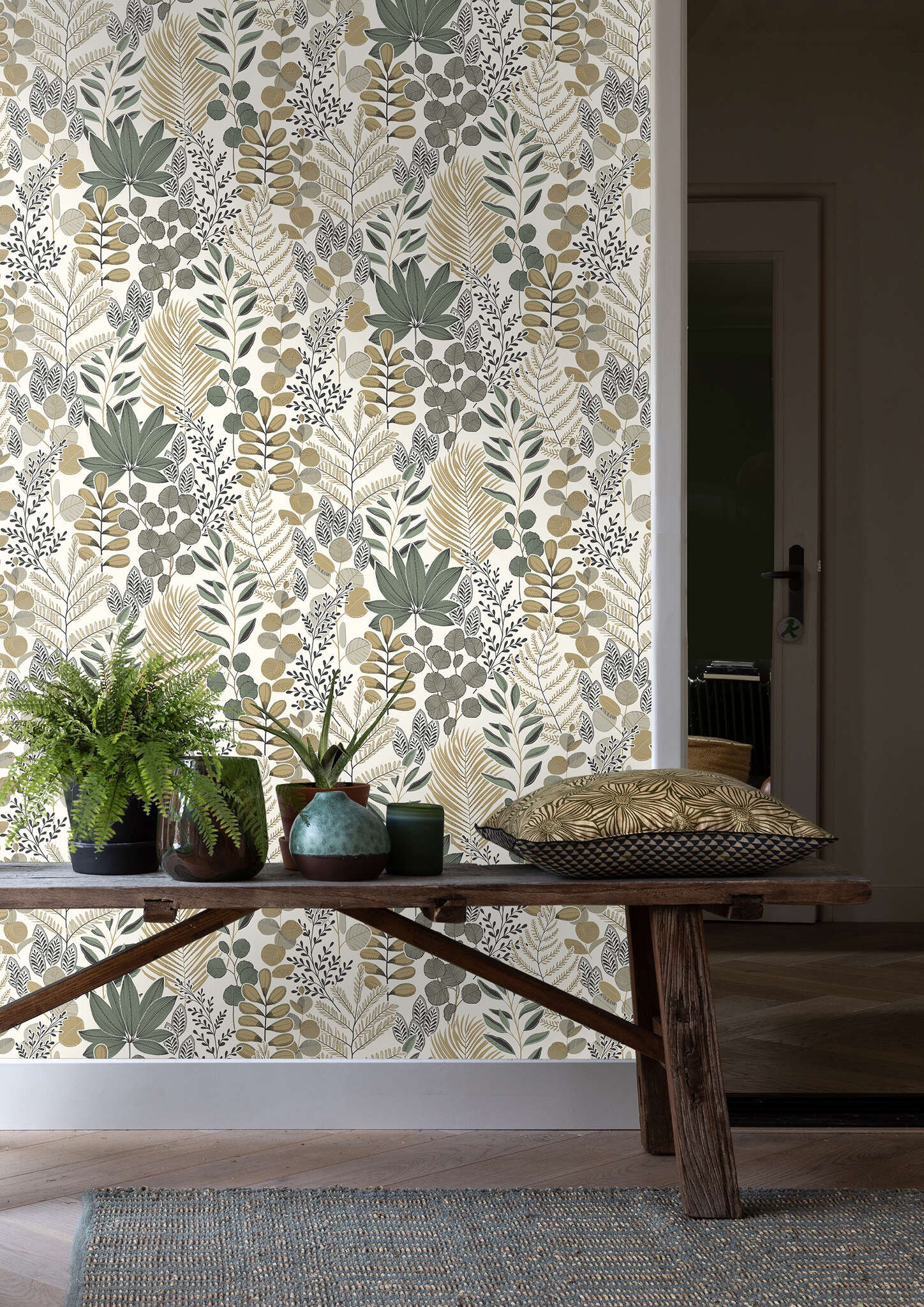 10-465334 Raumbilder 1 Room with Detailed leaf graphic in ochre, green, beige and black on a light background – stylised nature for modern living spaces.