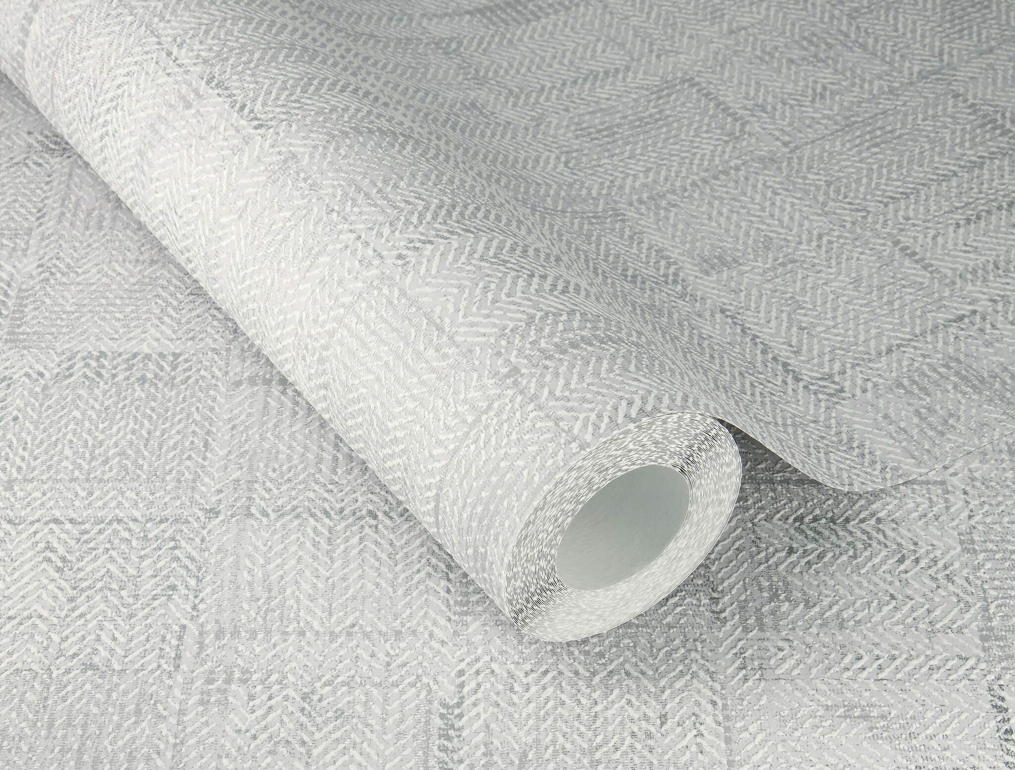 10-314731 Detailaufnahmen 1 Detailed image of Silver-grey non-woven wallpaper with a woven patchwork texture and a slightly raised look