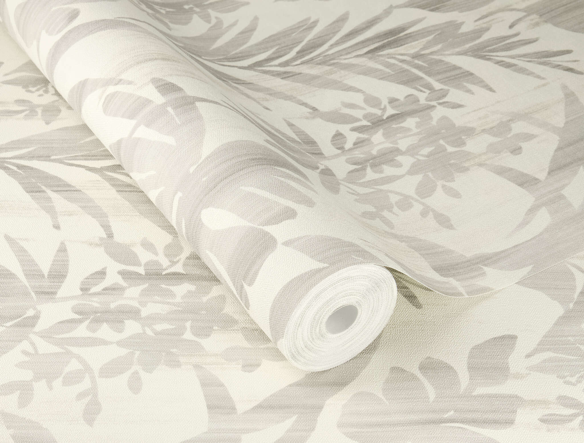 10-410556 Detailaufnahmen 1 Detailed image of Non-woven wallpaper with tropical leaf pattern in various shades of grey on a light background.