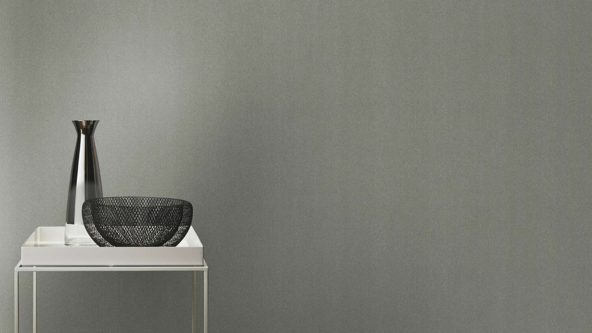 10-441611 Raumsituationen 5 Room with Plain non-woven wallpaper in mid-grey with a fine grooved surface.